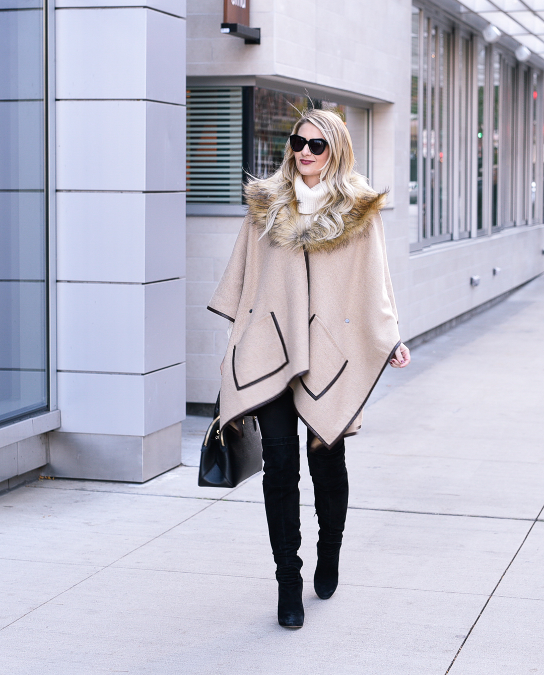 Jenna Colgrove wearing the Evy's Tree Vanessa cape in brown with a fur collar! 