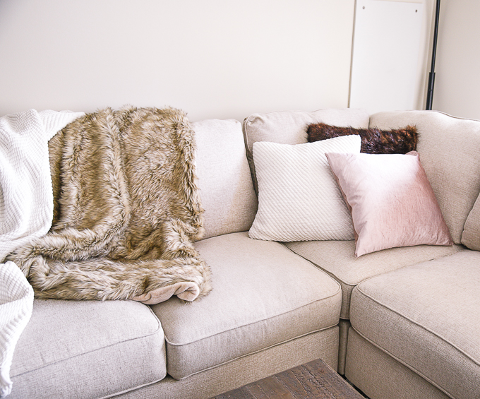 Mix and match your throw pillows for a trendy living room couch look. 