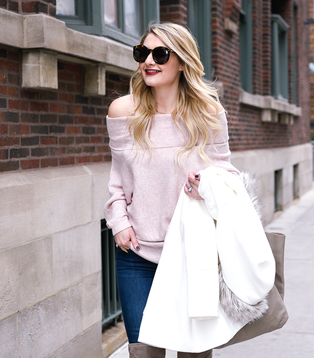 Jenna Colgrove wearing a Heartloom off the shoulder pink sweater. 