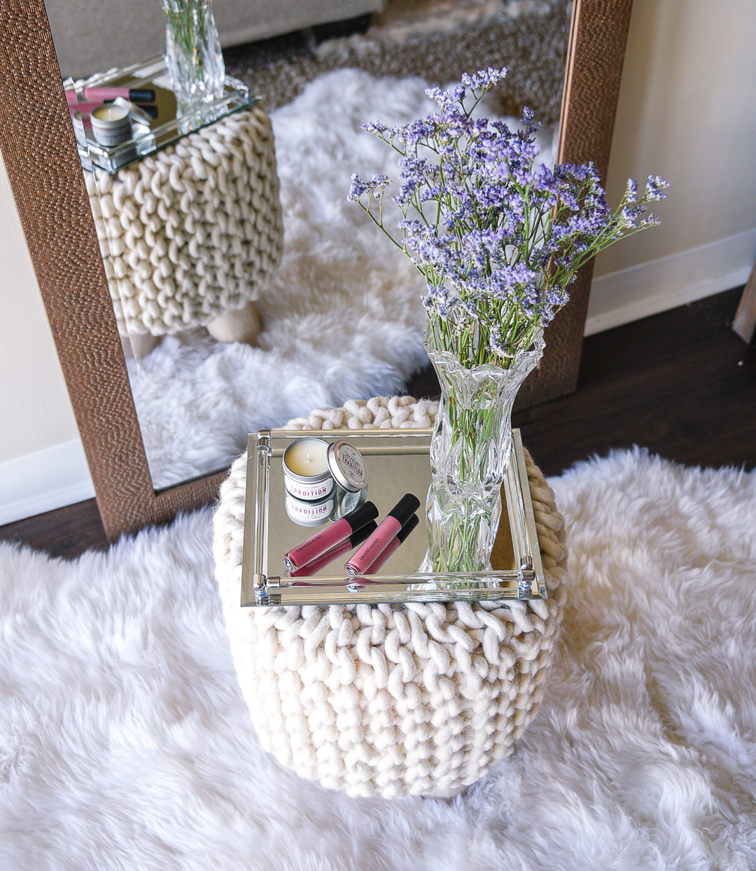 A mirrored tray and crystal vase for decorating your home. 