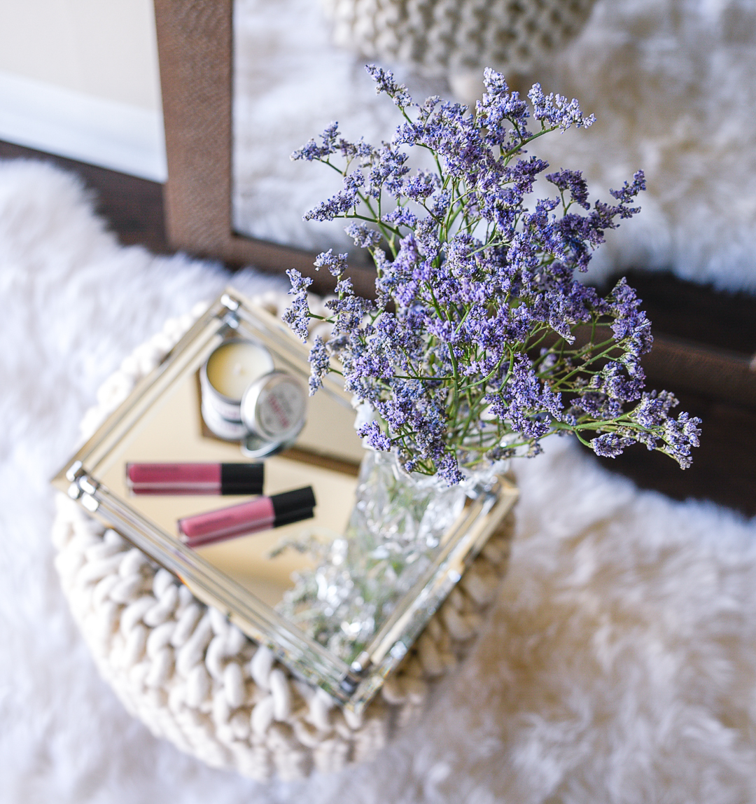 Lavendar flowers and a soy candle.