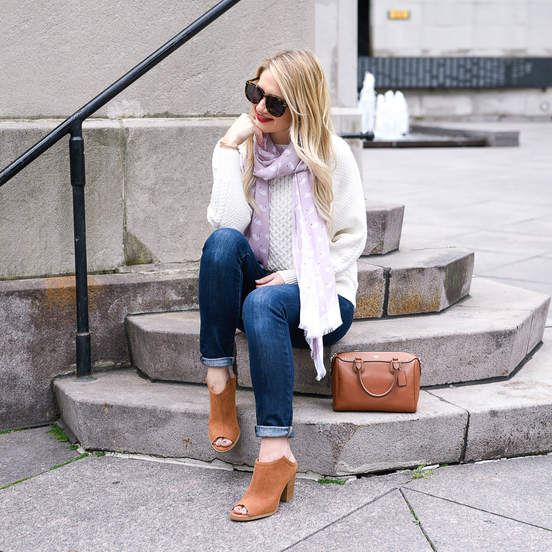 Brown restricted booties and a pink scarf. 