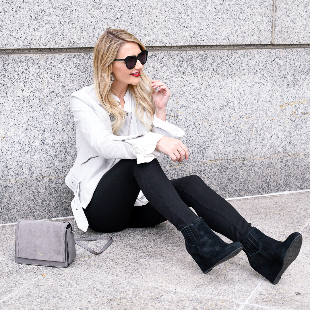 Black suede wedges and a grey moto jacket. 