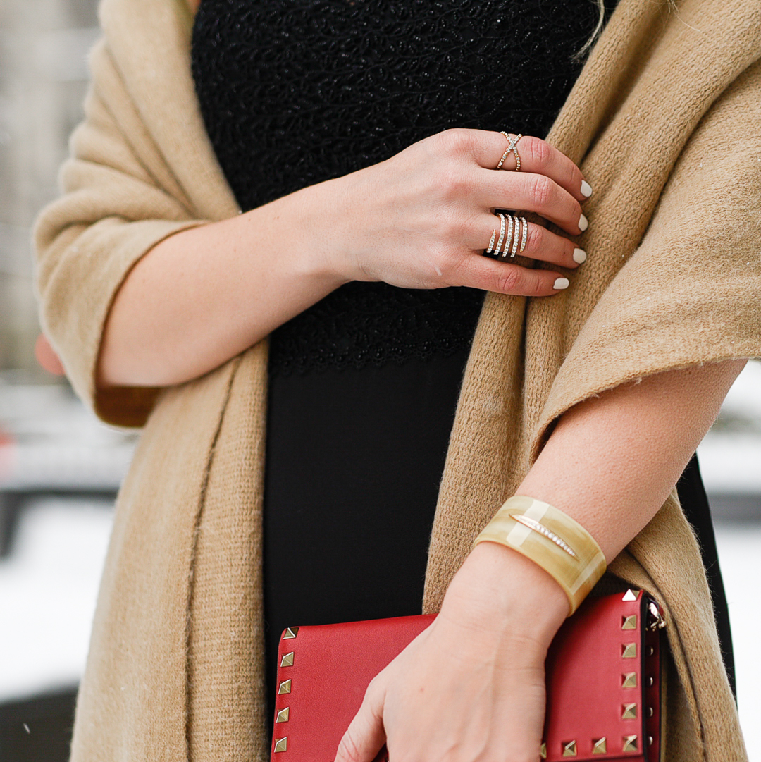White nail polish and a beige cuff by ADORE jewelry. 