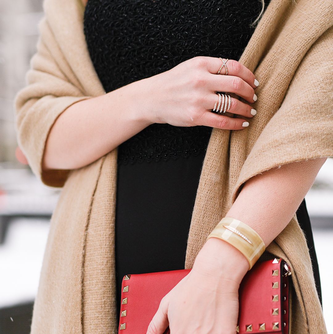 Beautiful resign cuff with diamond detail and a Valentino wallet bag. 