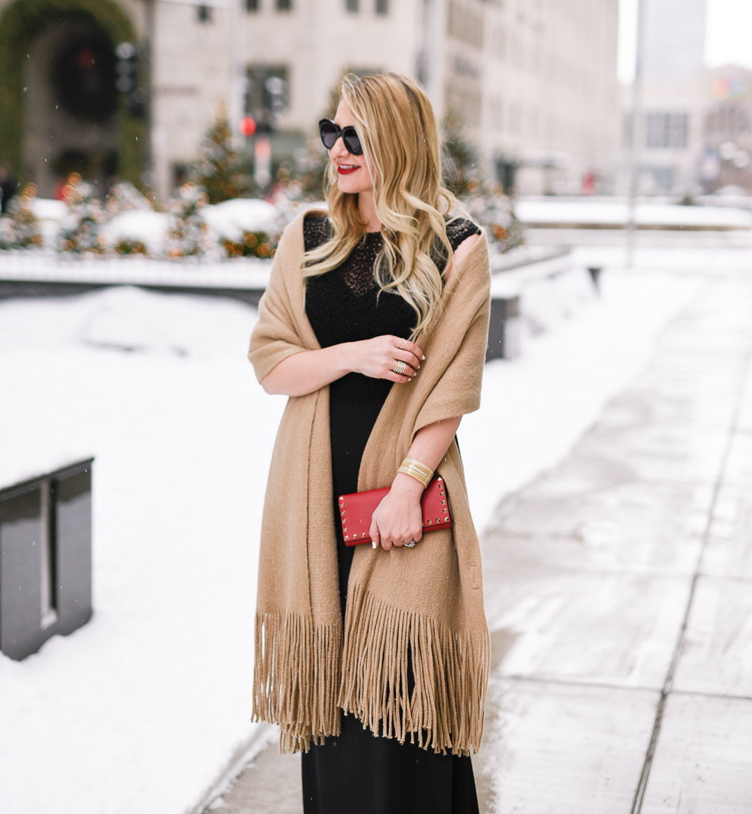 Jenna Colgrove wearing an Alyce Paris maxi dress and fringe beige colored scarf. 
