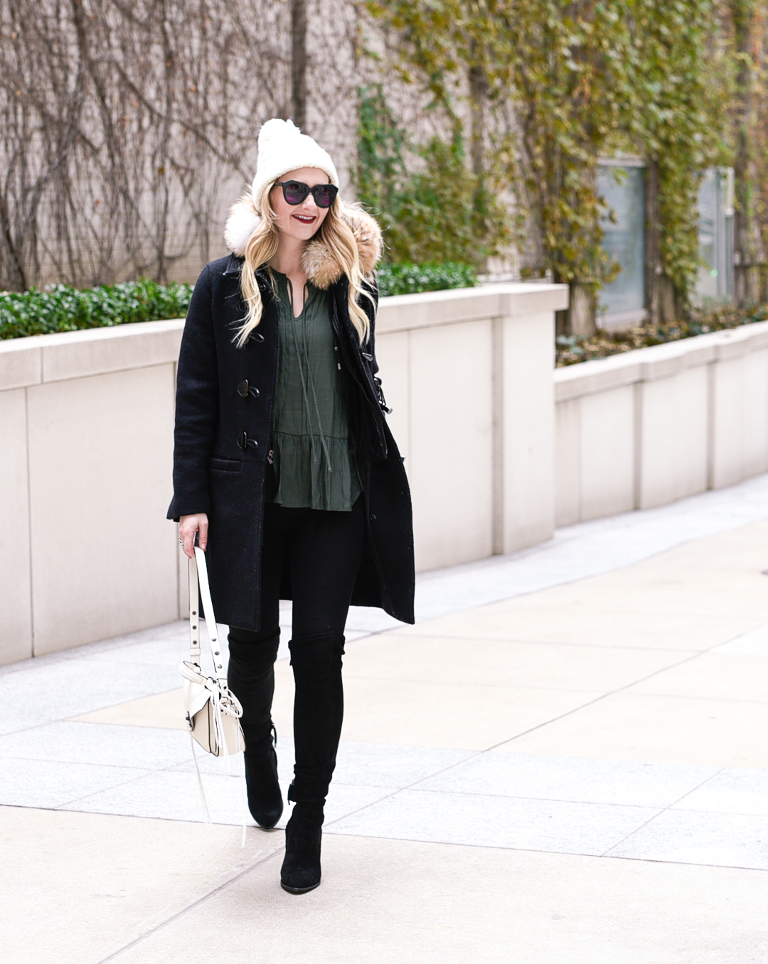 Layering a black J.Crew parka, black skinny jeans, and suede over the knee boots. 