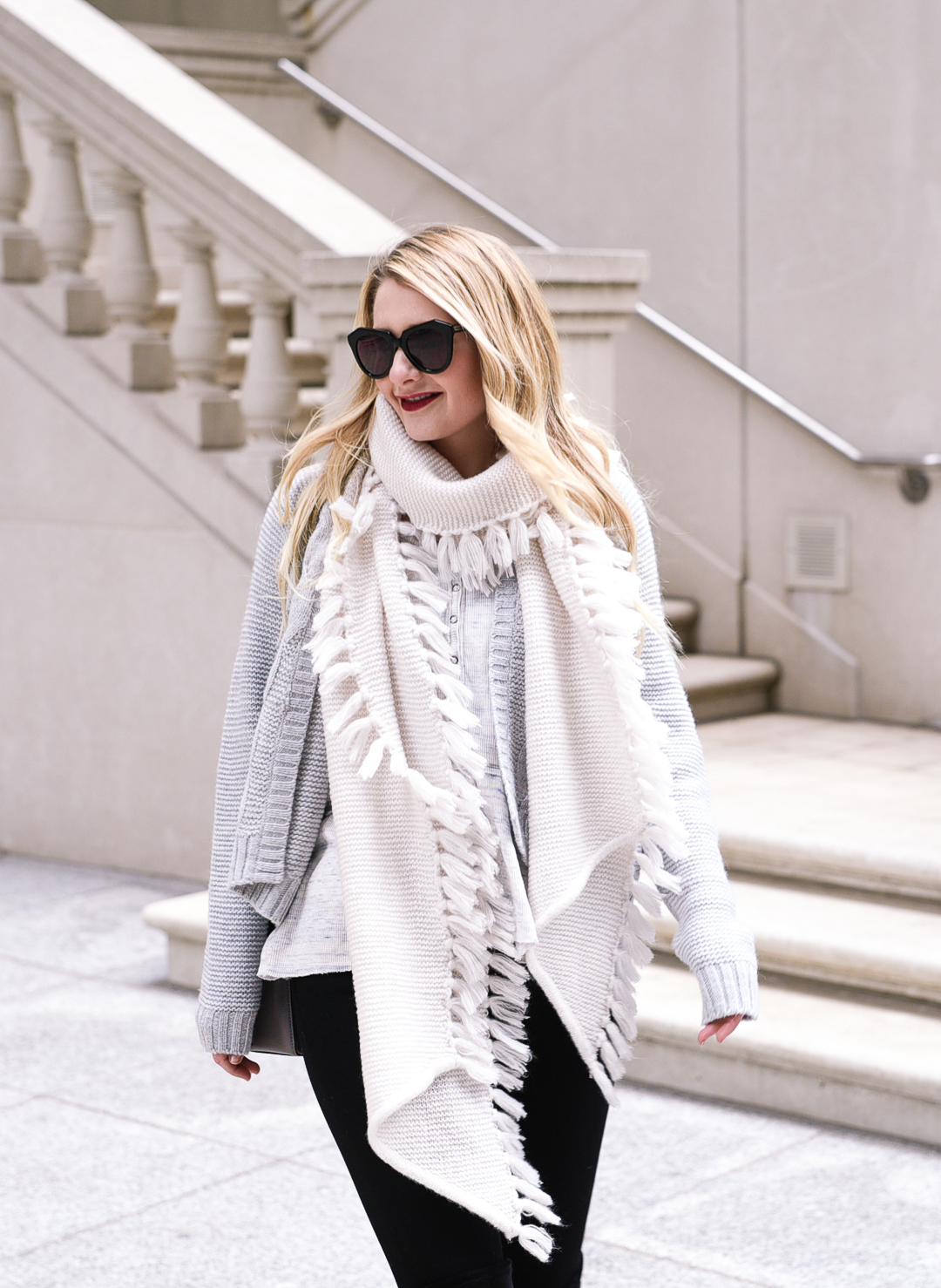 Cozy winter style with a grey cardigan, white scarf, and grey thermal top.