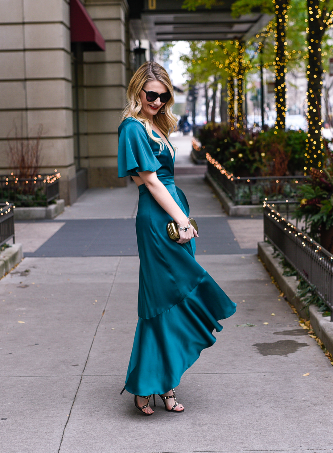 Jenna Colgrove wearing a satin jewel toned wrap dress from Rent the Runway. 