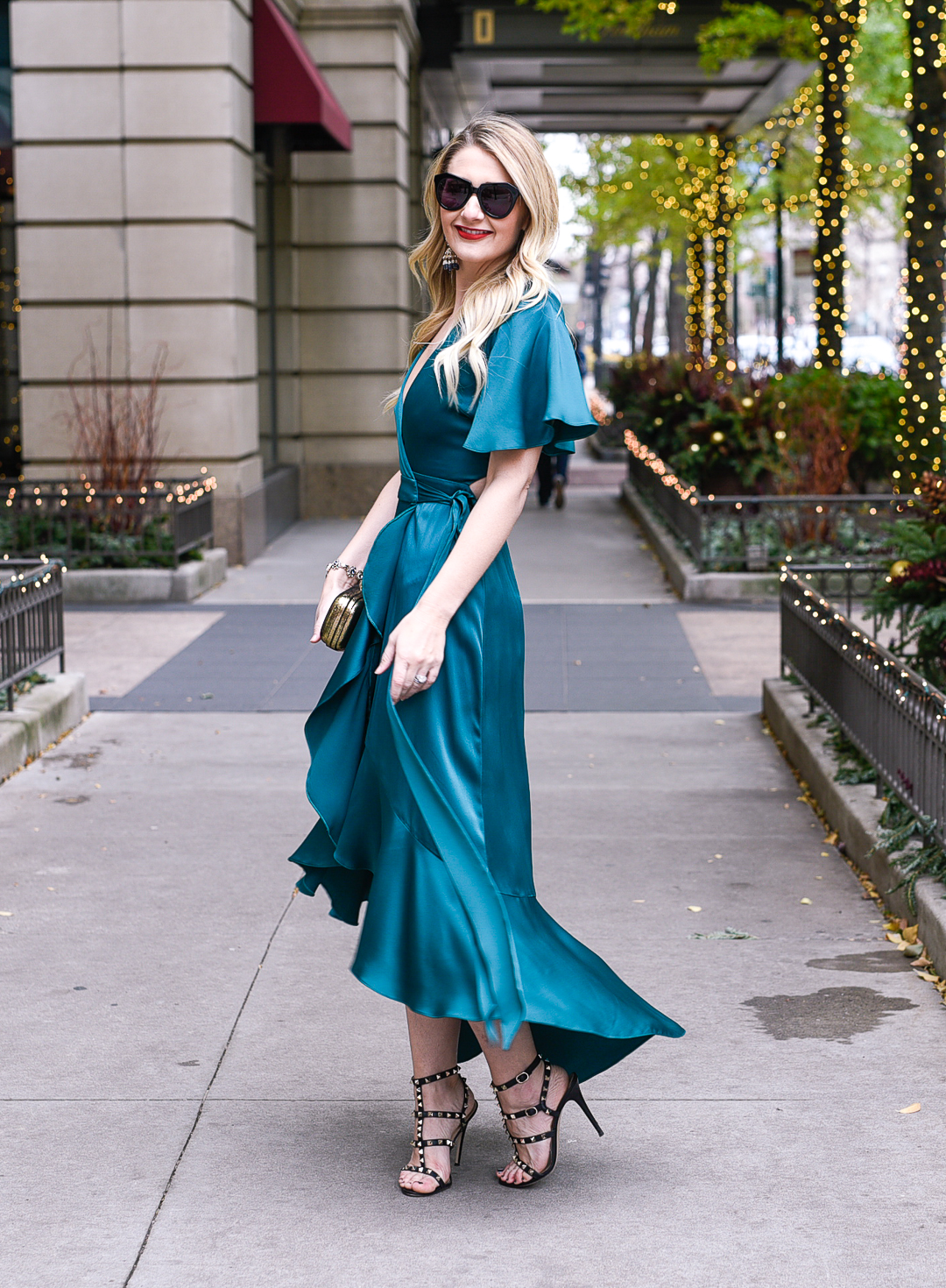Jenna Colgrove wearing the Temperly London Emerald Parrot Wrap Dress from Rent the Runway. 