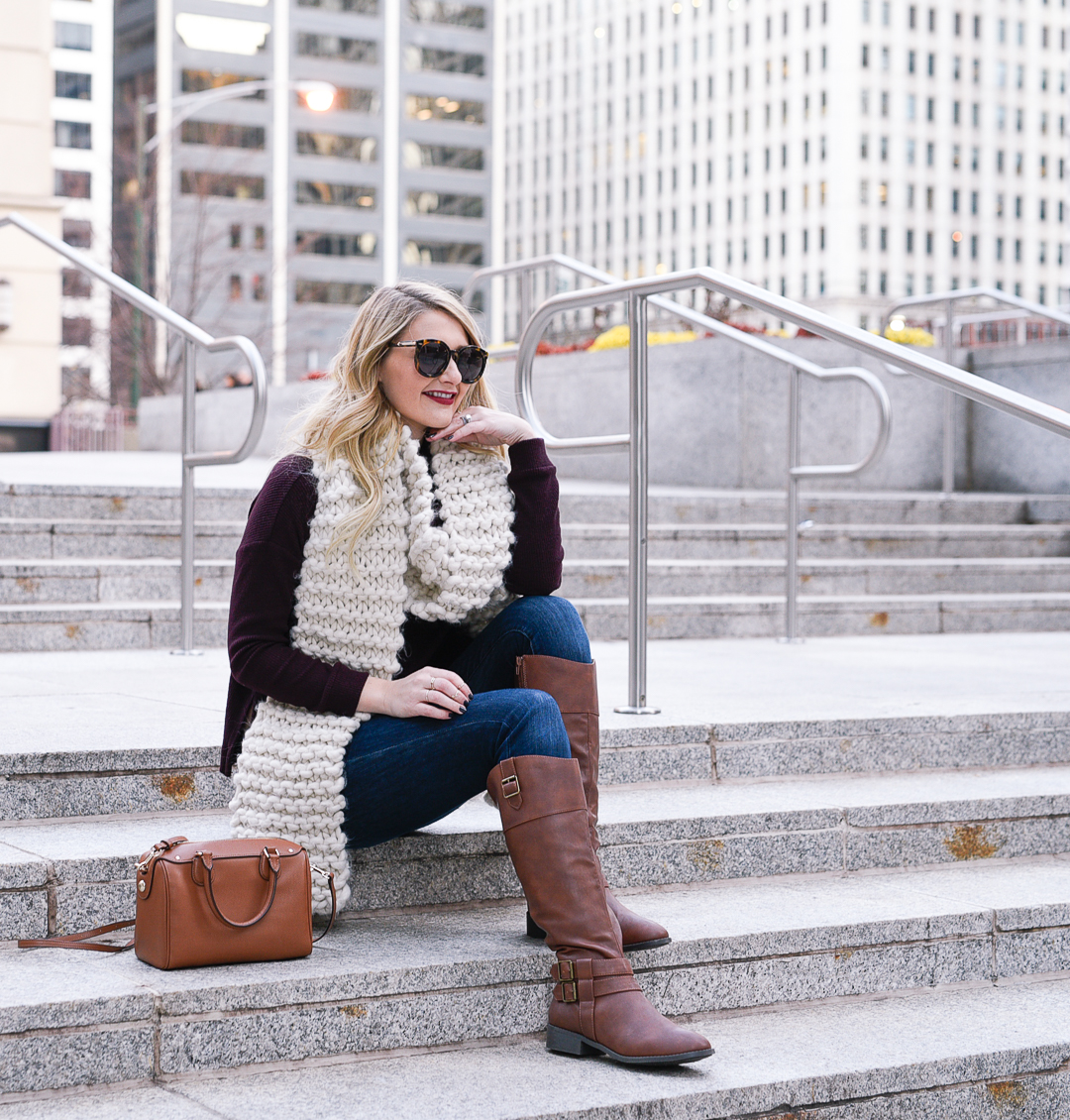 Jenna Colgrove wearing Payless riding boots, a lush burgundy sweater, and a Coach satchel bag.