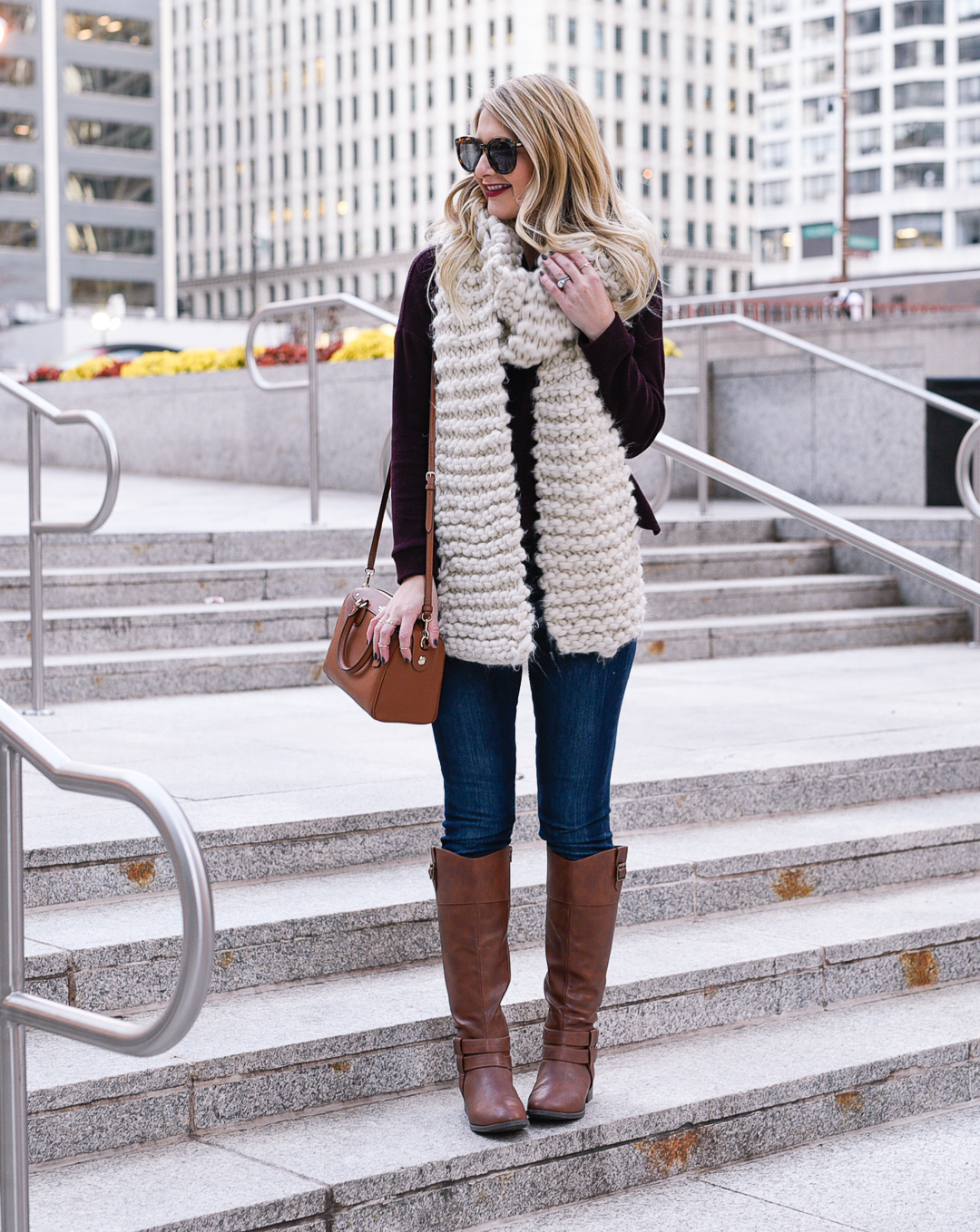 Fall outfit idea: riding boots, burgundy turtleneck, and knit scarf. 