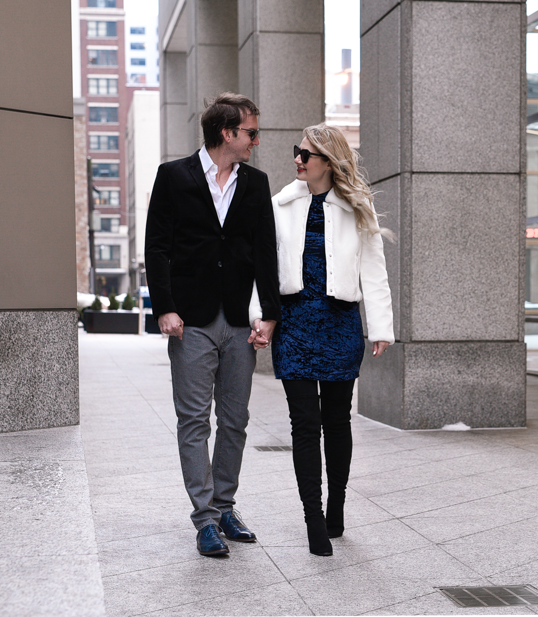 Blue velvet dress, white fur jacket, and over the knee boots.