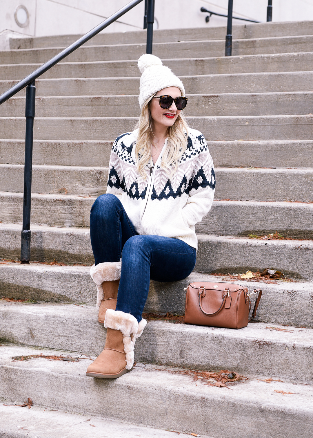 Jenna Colgrove wearing a fairisle sweater and fur boots. 