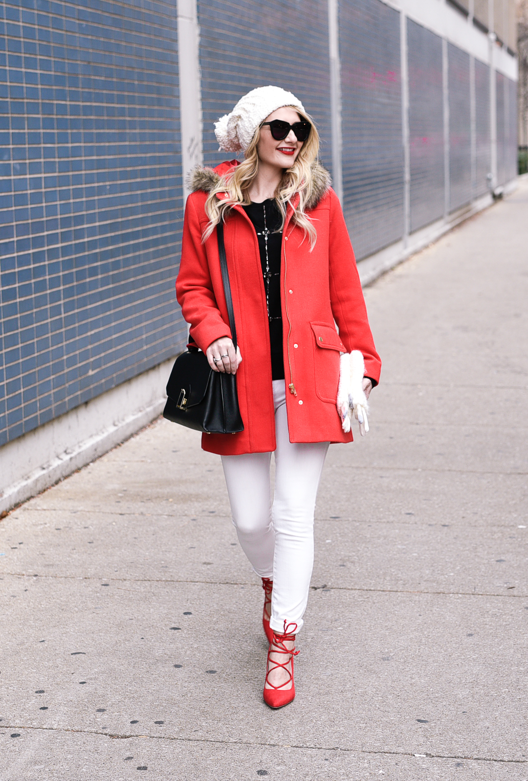 Red Vail Parka, White skinny jeans, red lace up pumps, and a black Henri Bendel satchel. 