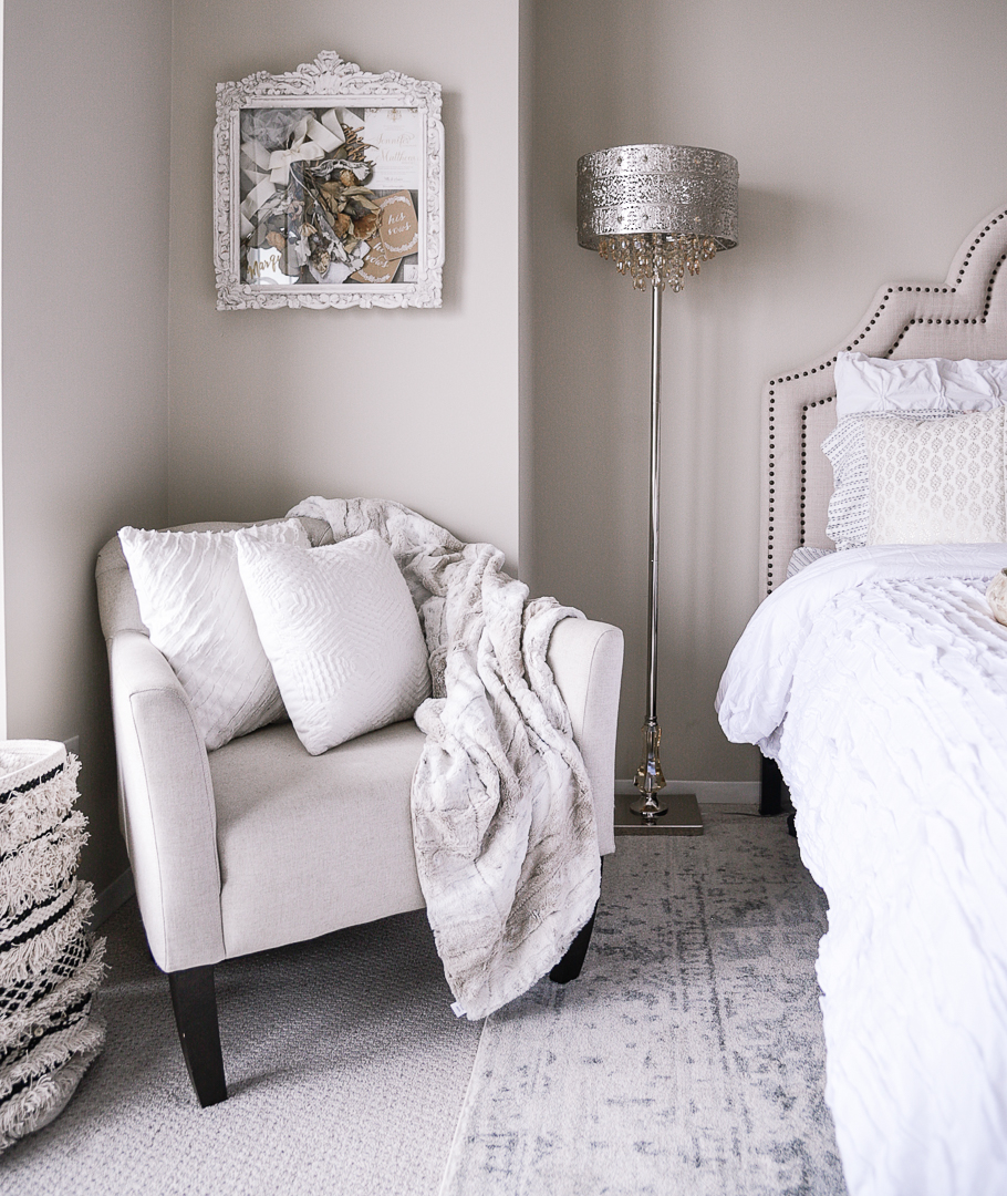 The West Elm Elton Chair and a Pier 1 faux fur blanket. - Second Bedroom Ideas with Havenly and Pier 1 by Chicago style blogger Visions of Vogue