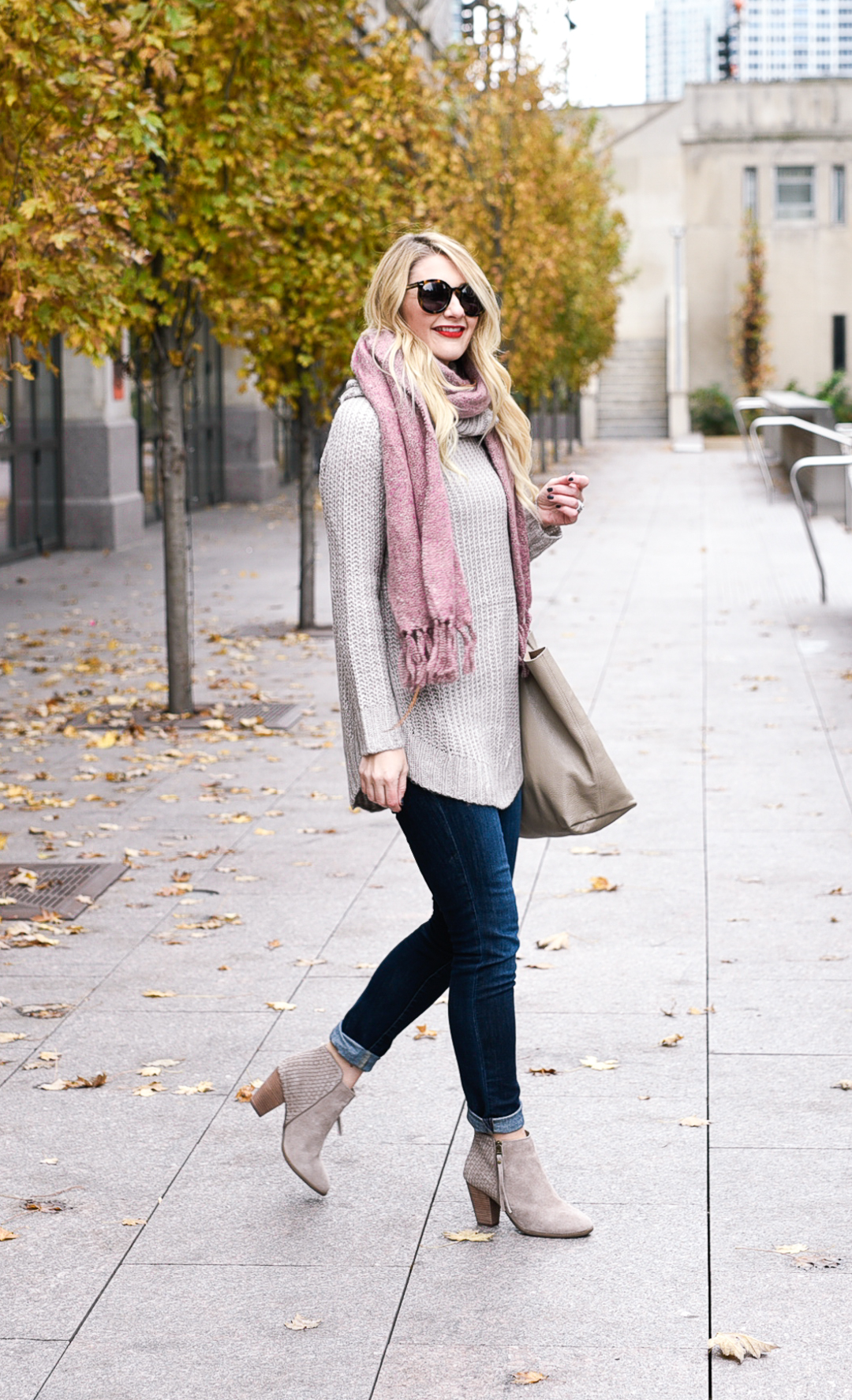 Taupe tunic and fringe suede booties with dark wash skinny jeans. 