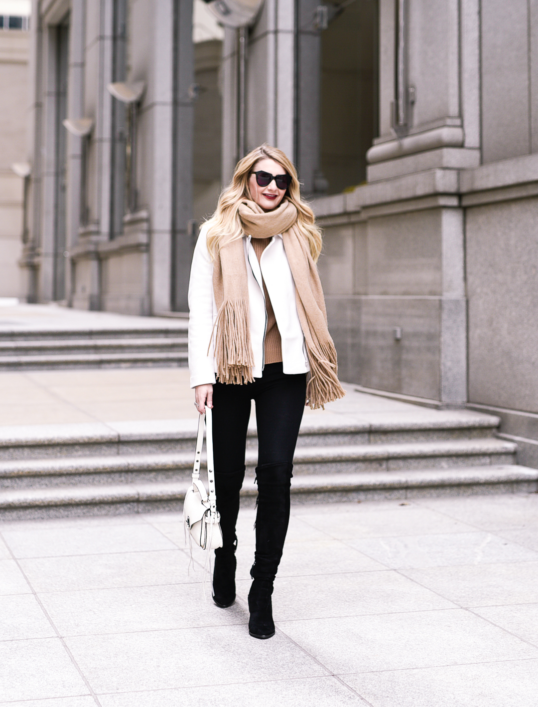 The best black over the knee boots and white suede moto jacket. 