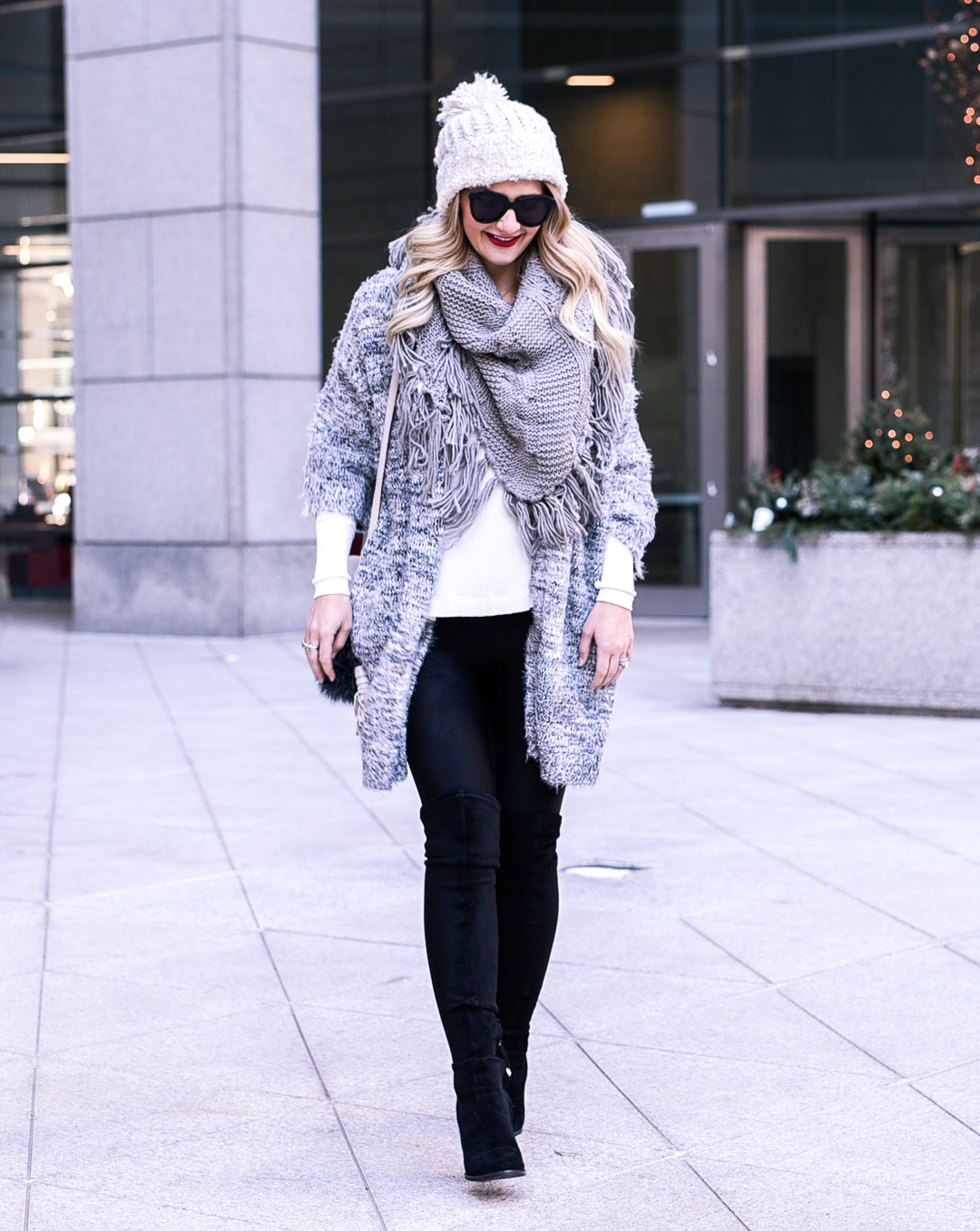 Grey fringe scarf and oversized eyelash sweater. 