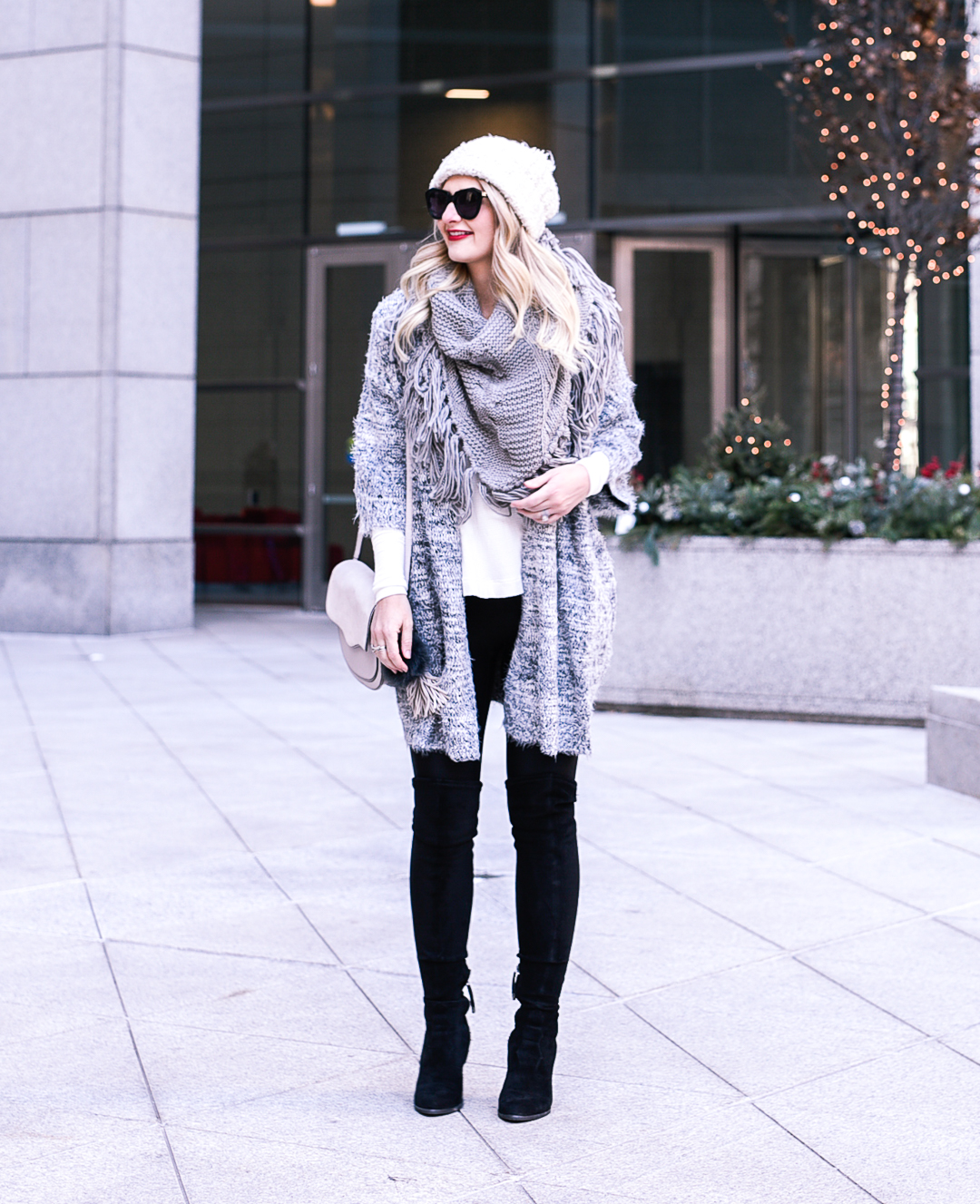 Jenna Colgrove wearing a Free People thermal, fluffy cardigan, and Spanx faux leather leggings. 
