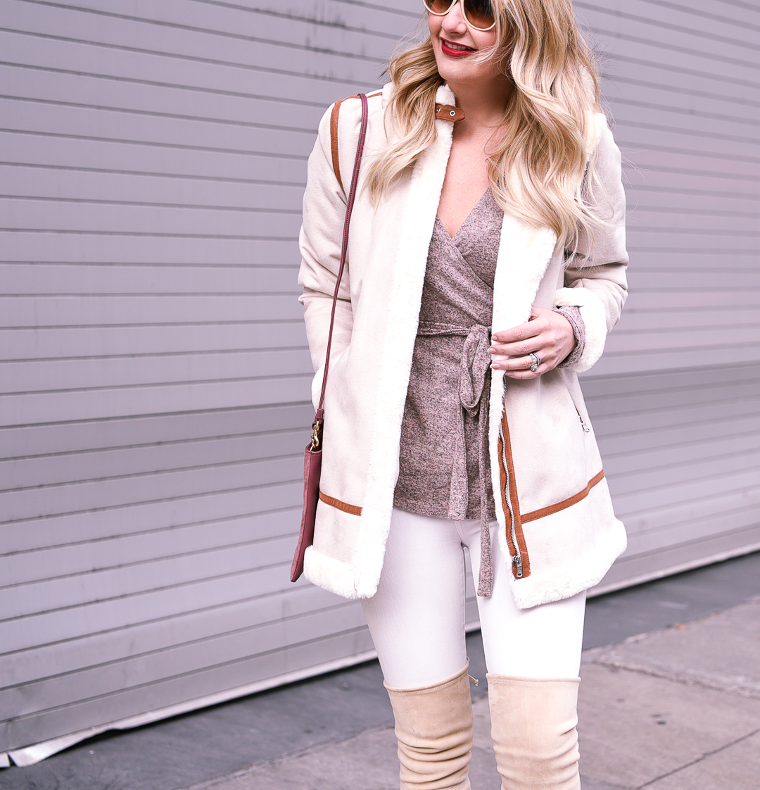 Heathered pink wrap sweater with white skinny jeans. 