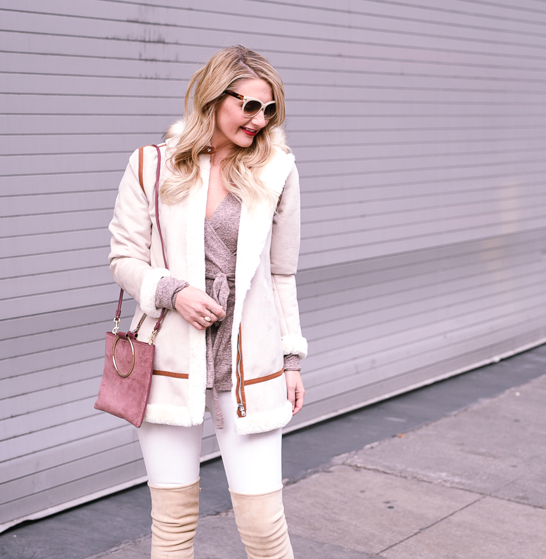 Staying warm in Chicago with a shearling coat and cotton wrap sweater. 
