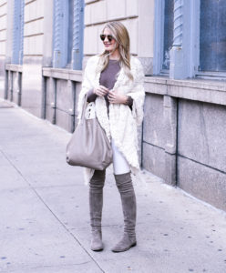 Stuart Weitzman Lowland Boots in Taupe with a white chunky knit wrap sweater.