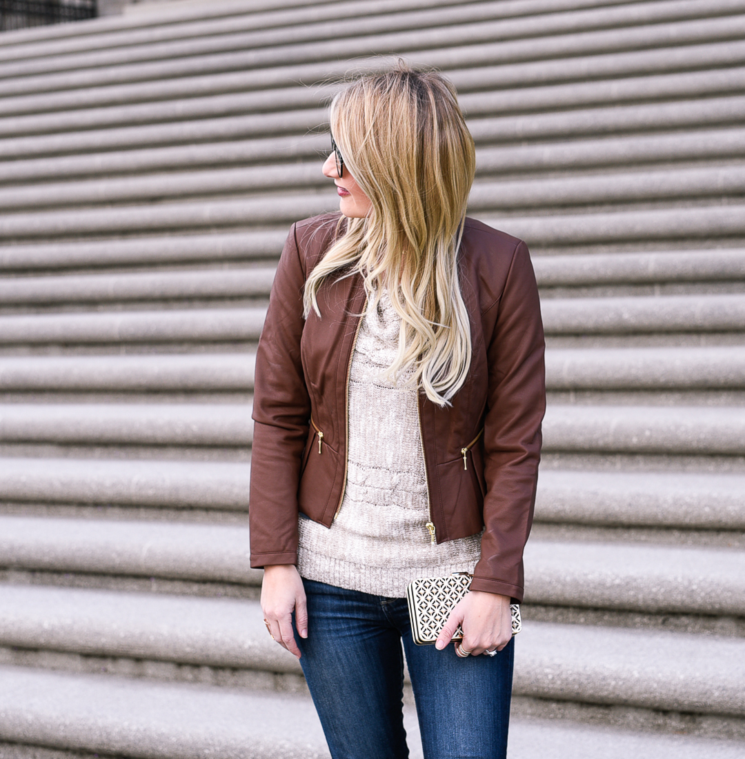 Structured brown leather moto jacket and knit sweater. 