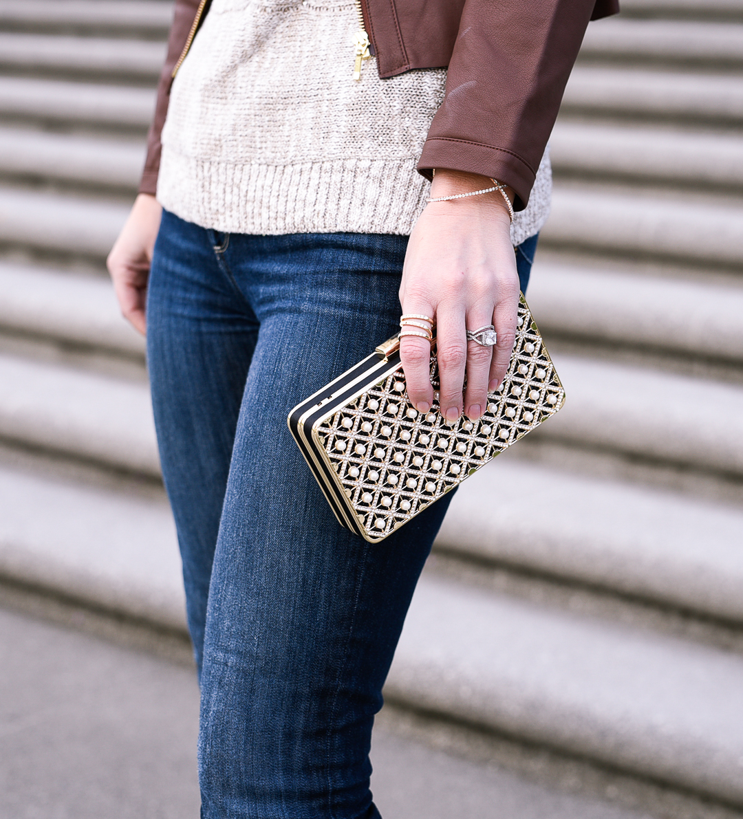 Gold box clutch with pearl embellishments. 