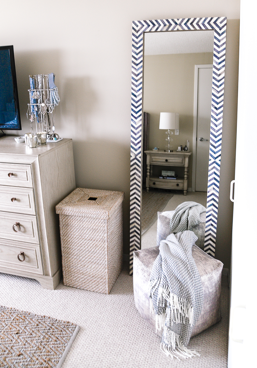 Textured hamper, velvet pouf, chevron throw, and herringbone floor mirror. - Master Bedroom Ideas with Home Decorators by Chicago style blogger Visions of Vogue