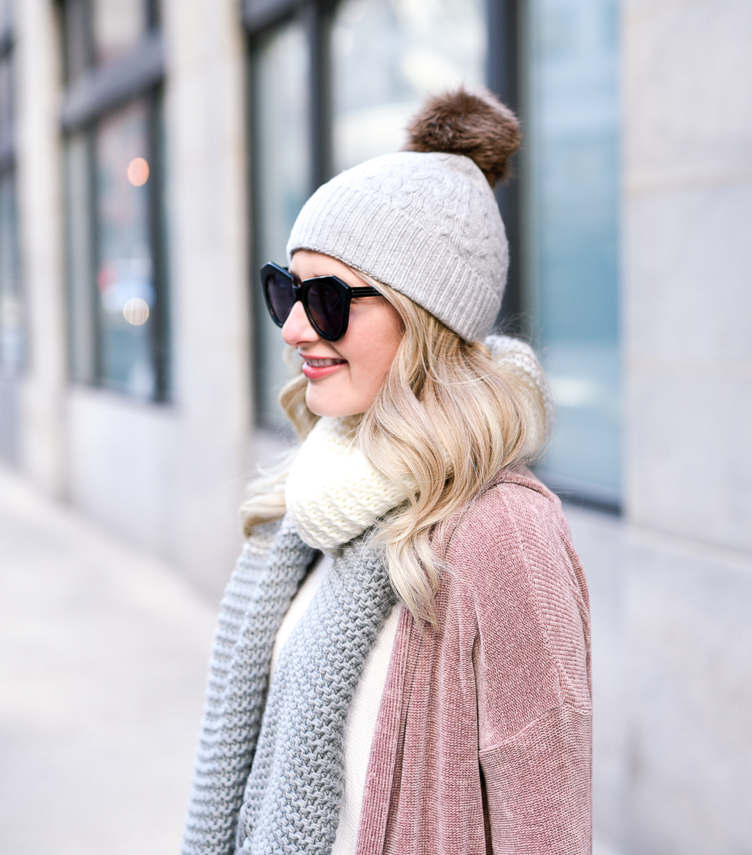 Cable knit pom beanie in grey by Rella. 