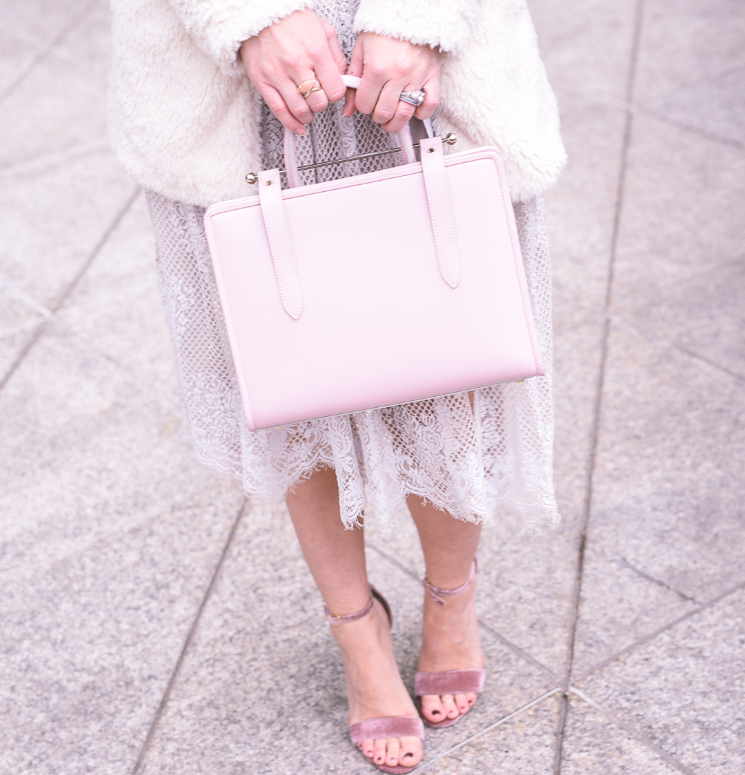 Blush pink tote bag with velvet strappy sandals. 