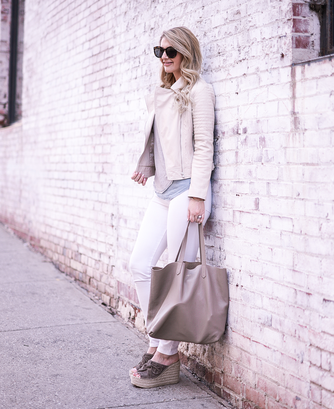 White skinny jeans with a BB Dakota Stafford ivory leather jacket. 