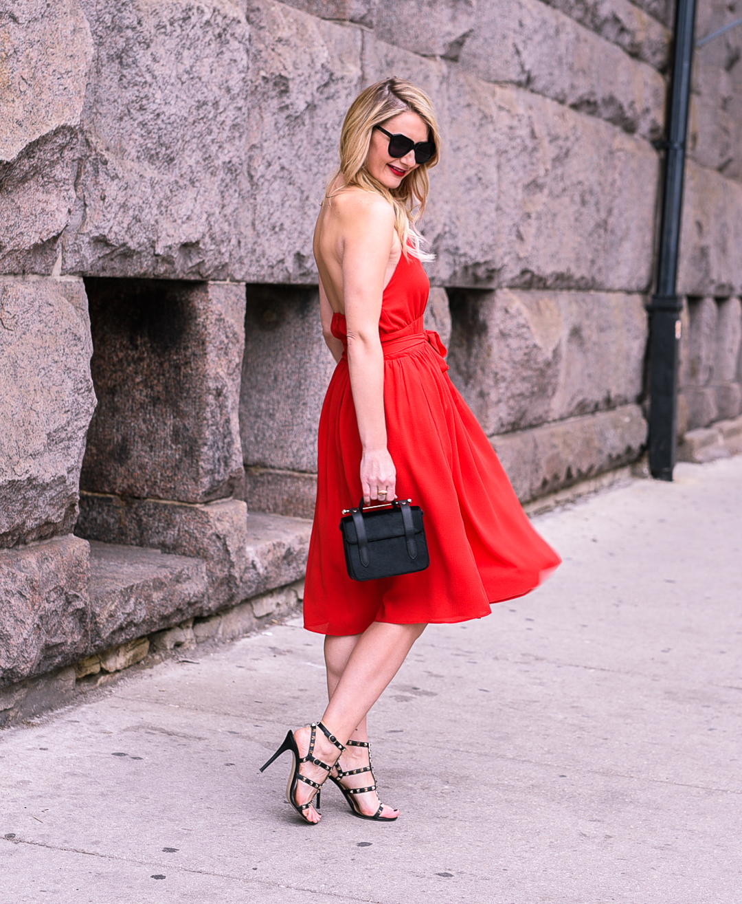 Twirling in a chiffon red gown. 