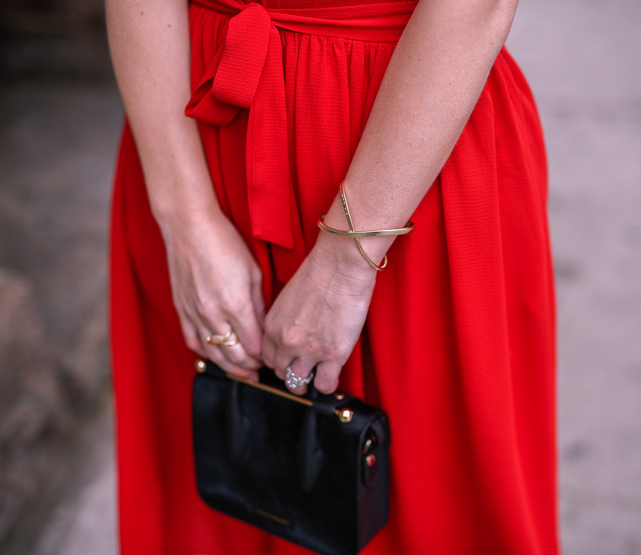Black calf hair clutch and a flowy red dress. 