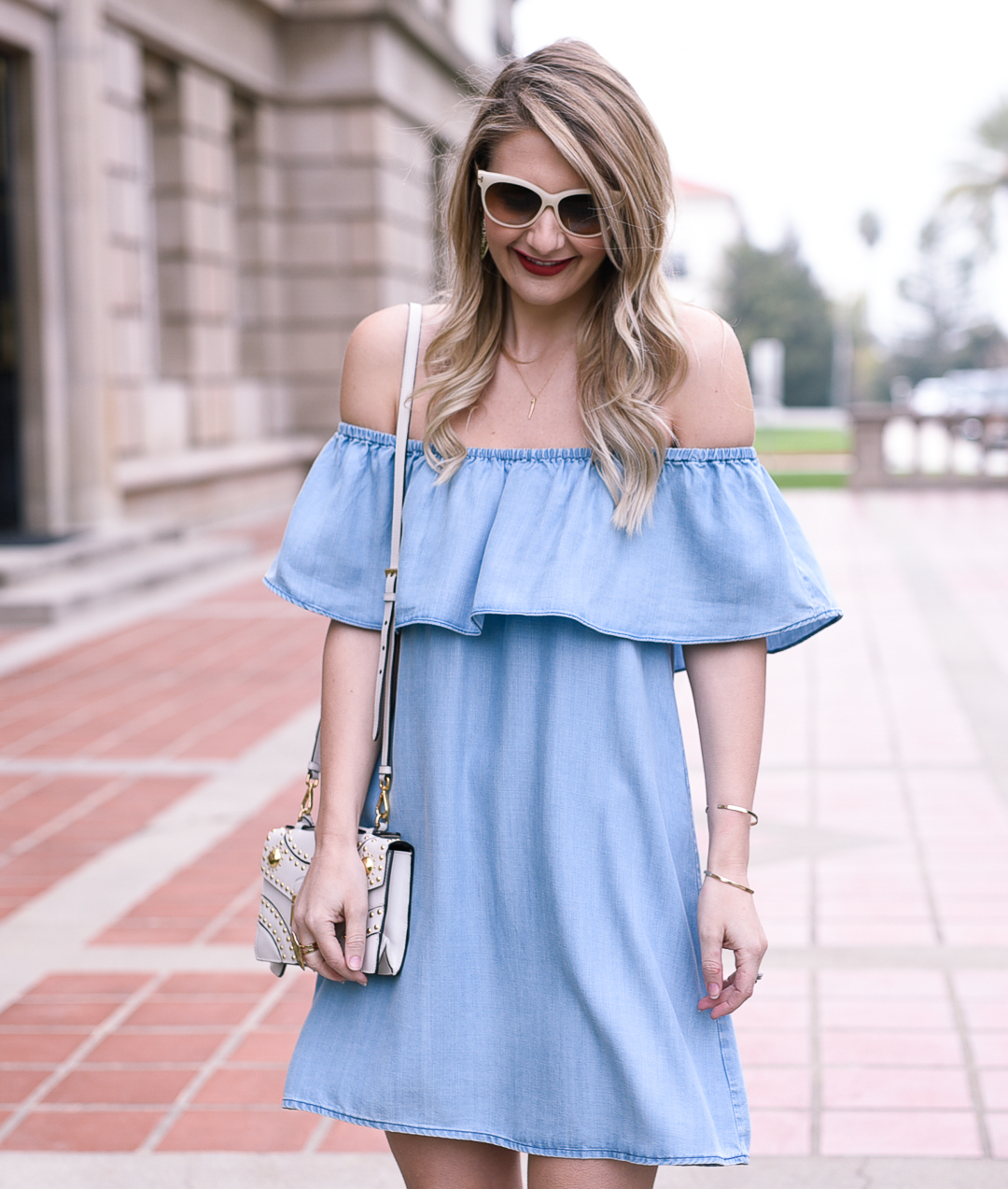 Light blue ruffled off the shoulder dress with a shift shape.
