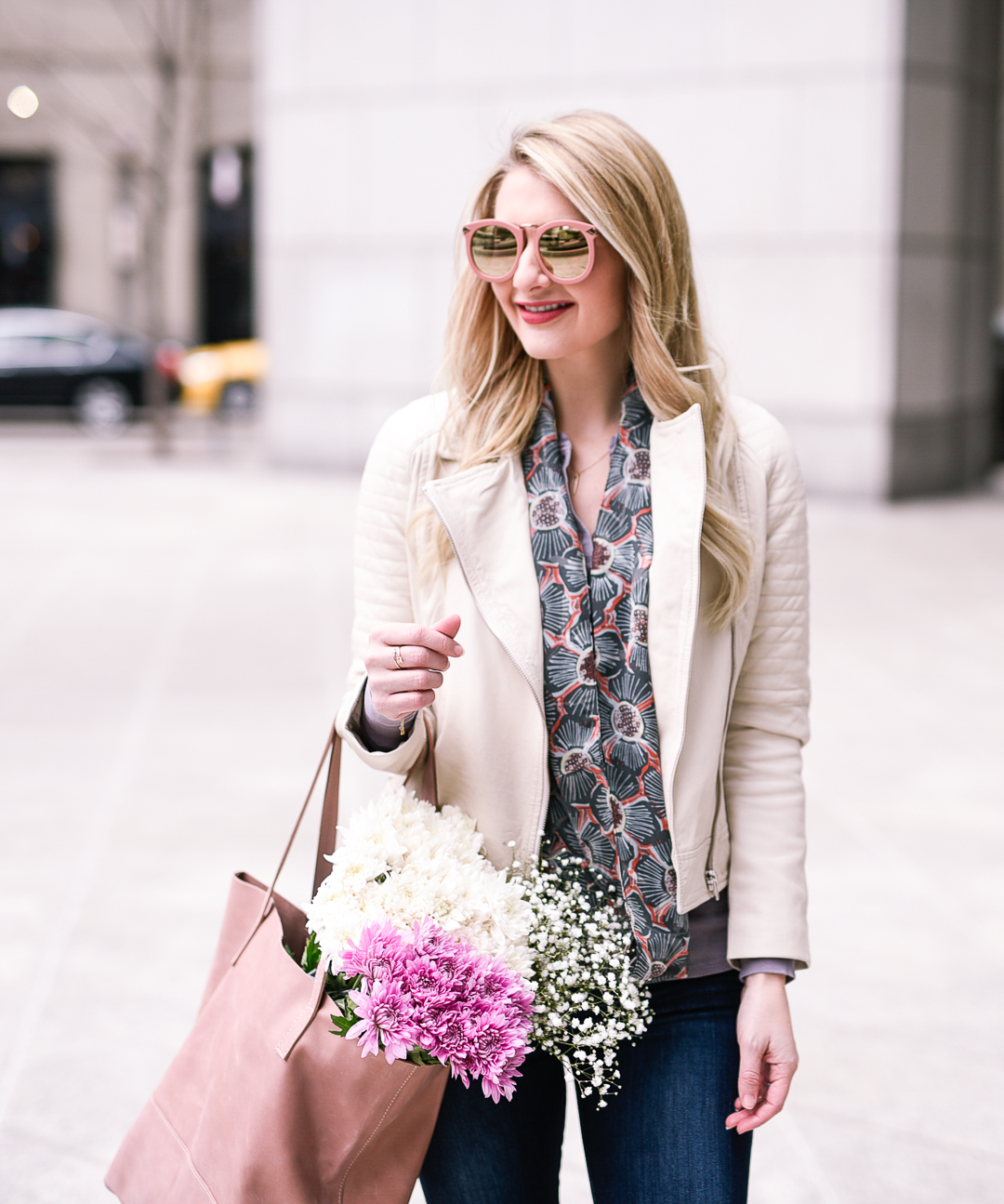 White leather jacket and patterned scarf. 