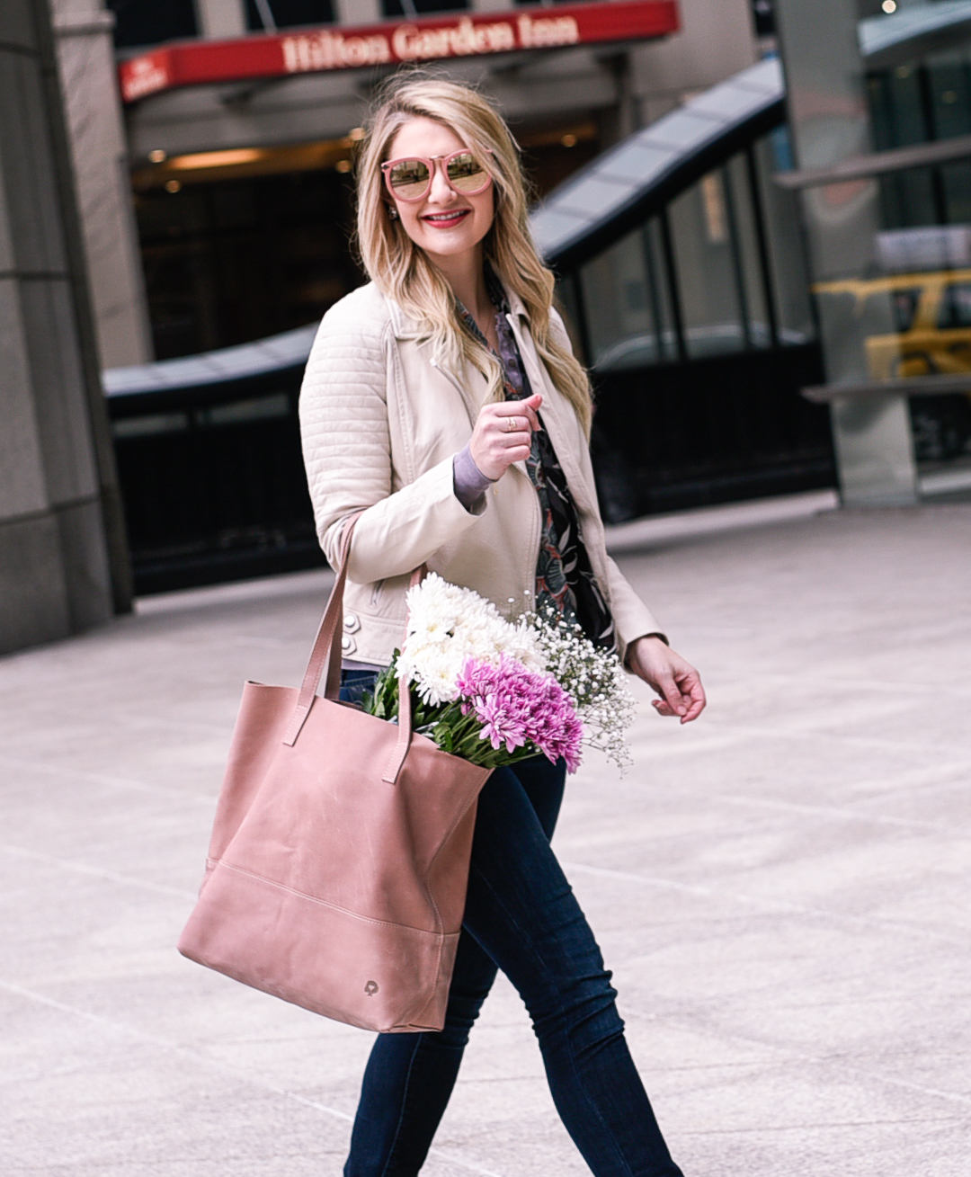 An ivory moto jacket and fresh flowers. 