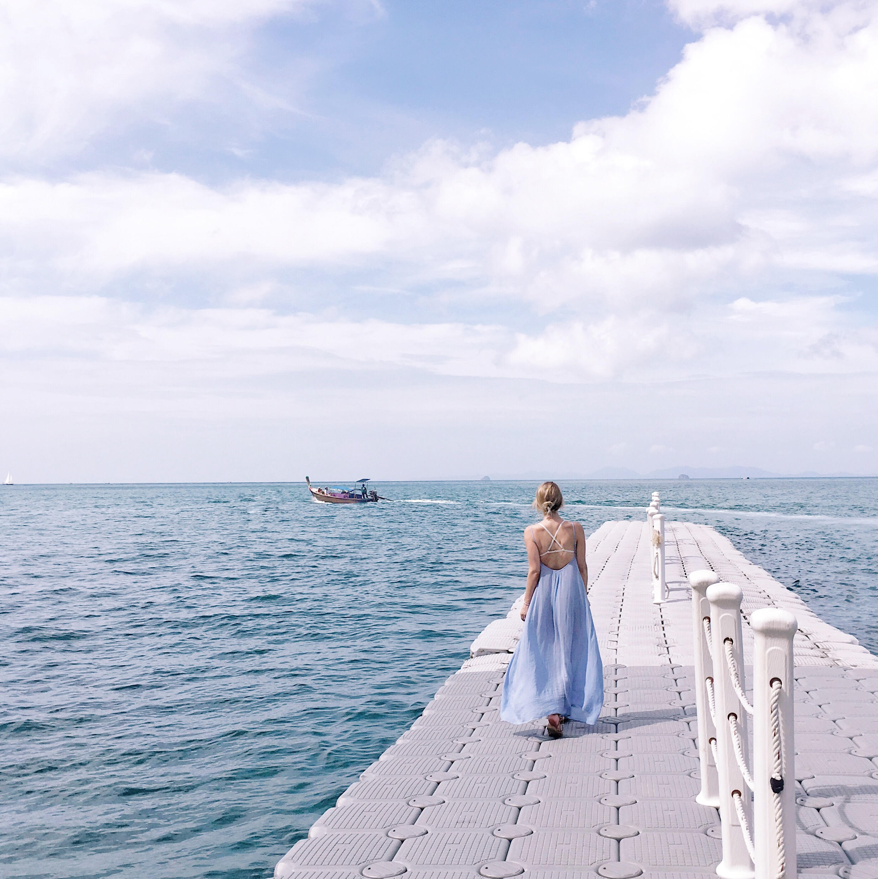 Blue beach maxi dress in Thailand at Krabi Beach. 