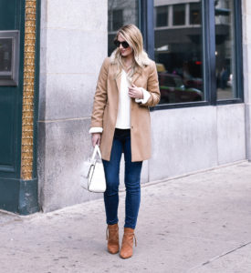 Beige colored jacket with fringe boots.