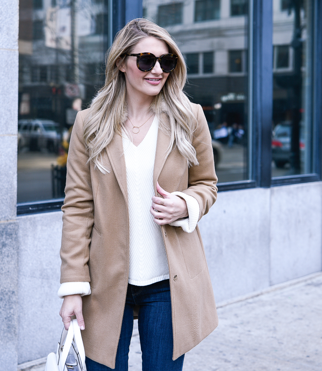Jenna Colgrove wearing the Free People La Brea sweater and a topshop camel coat. 