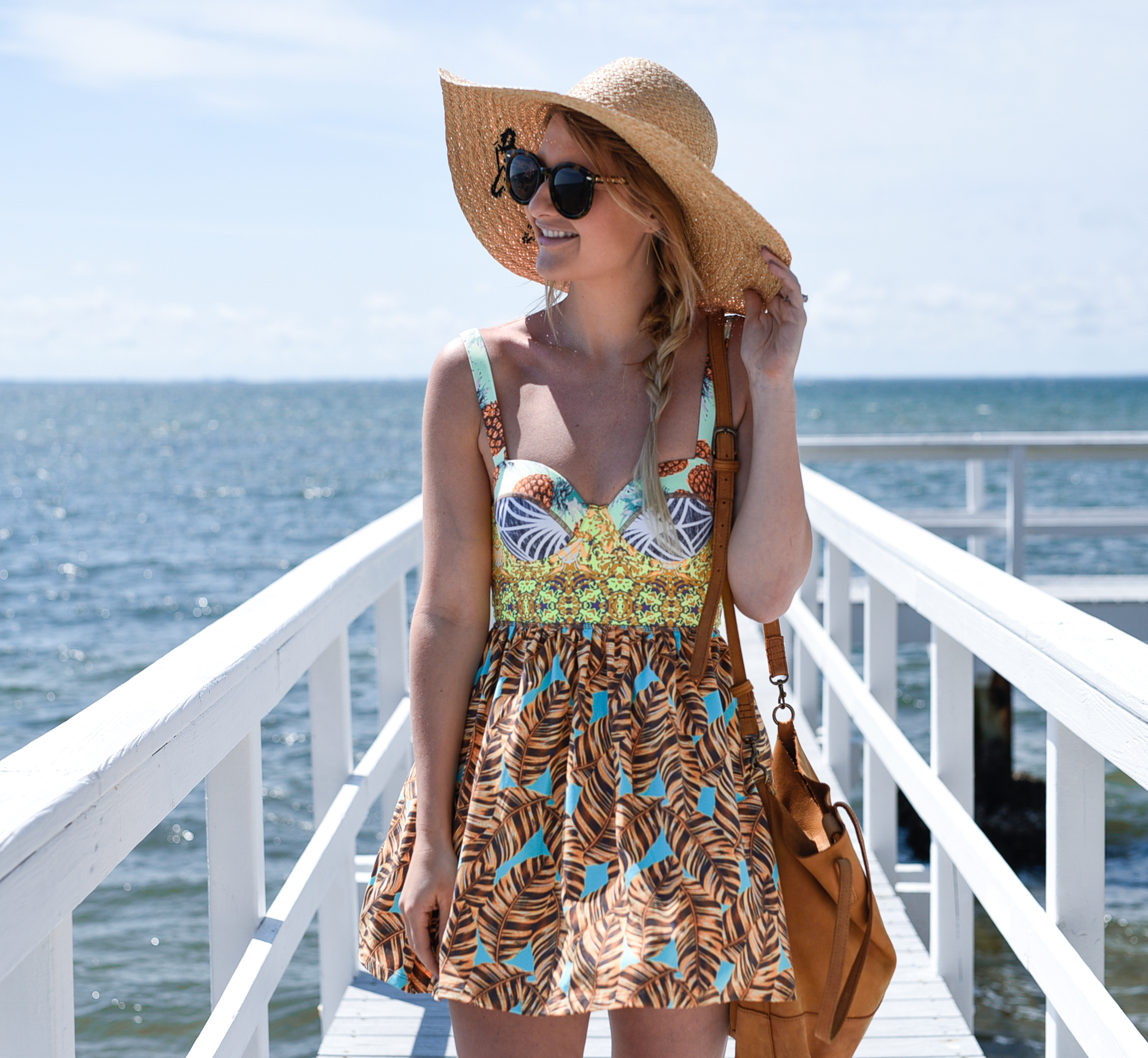 colorful printed fit and flare dress with a sun hat 