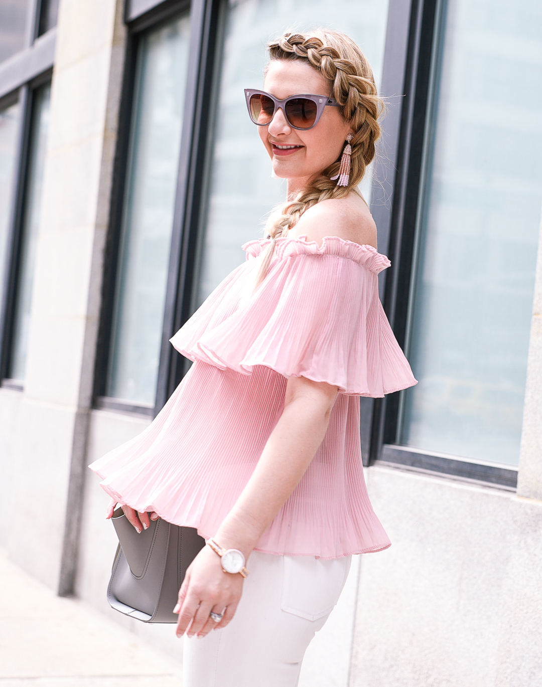 Pretty in a blush pink crinkled flutter top. 