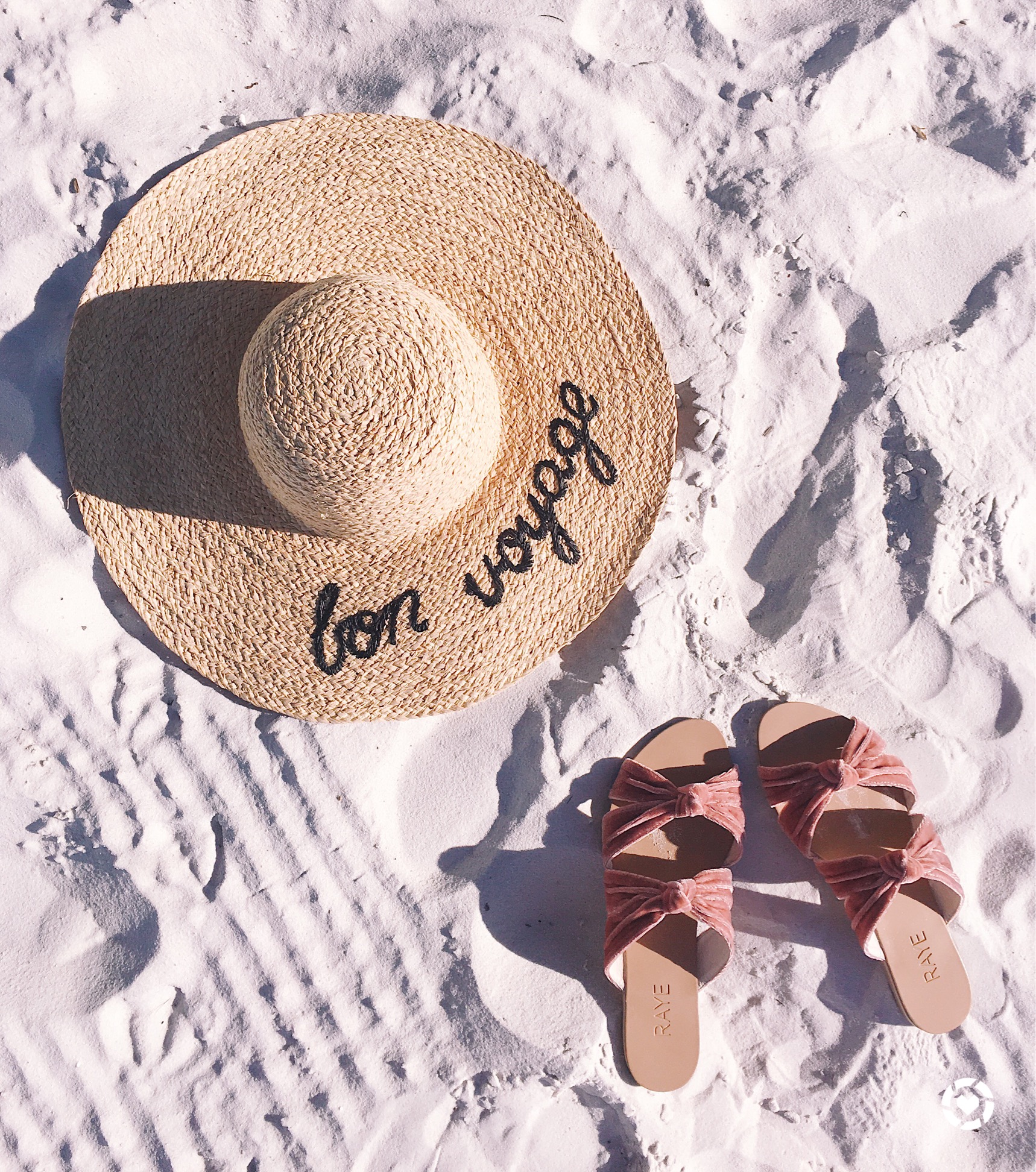 Blush pink velvet sandals and a bon voyage wide brimmed hat.