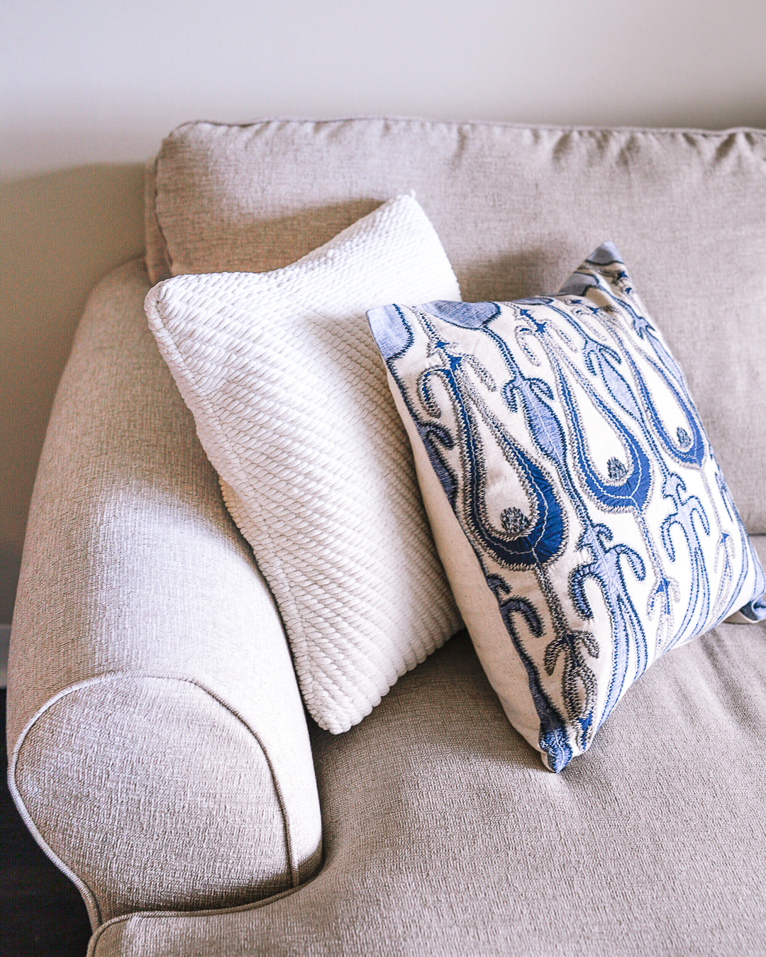 Blue ikat peacock pillow for color in the living room. 