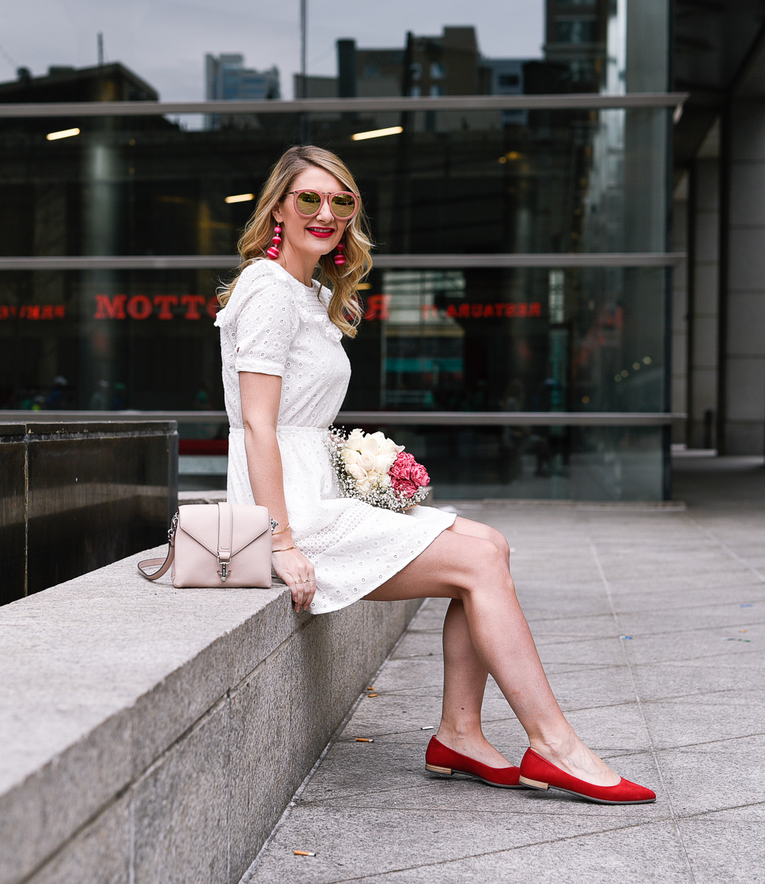 Red statement flats with a blush pink leather crossbody. 