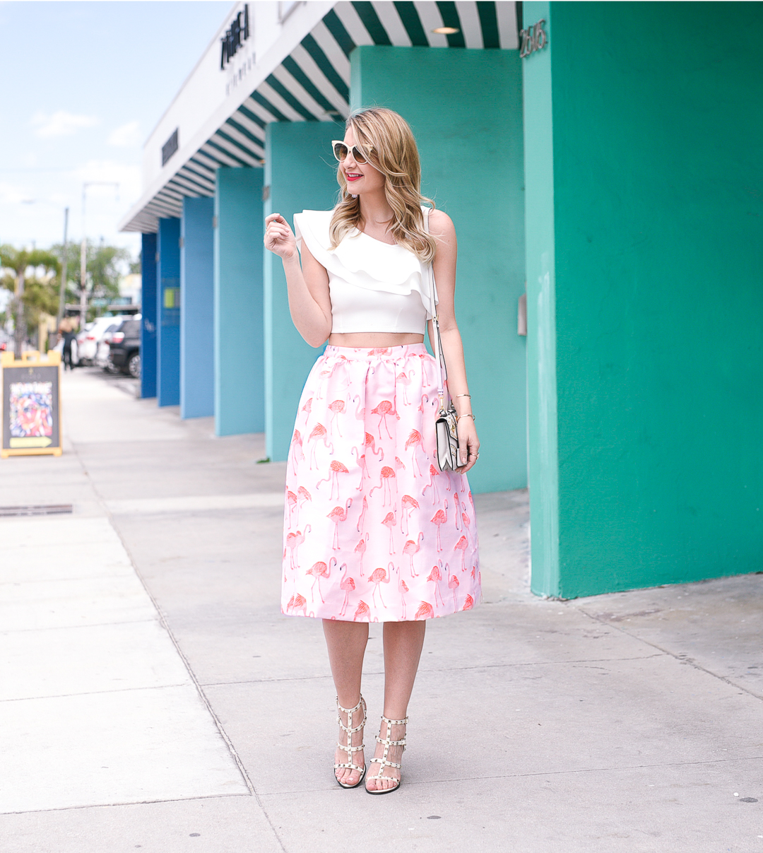 Pink flamingo print skirt and a white ruffled crop top from ASOS