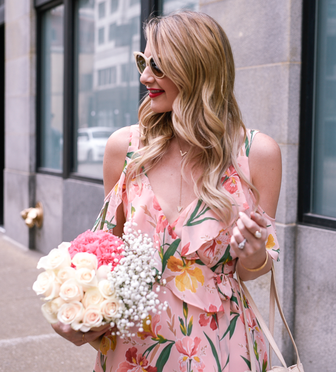 Gold Y necklace with fresh flowers and loose waves. 