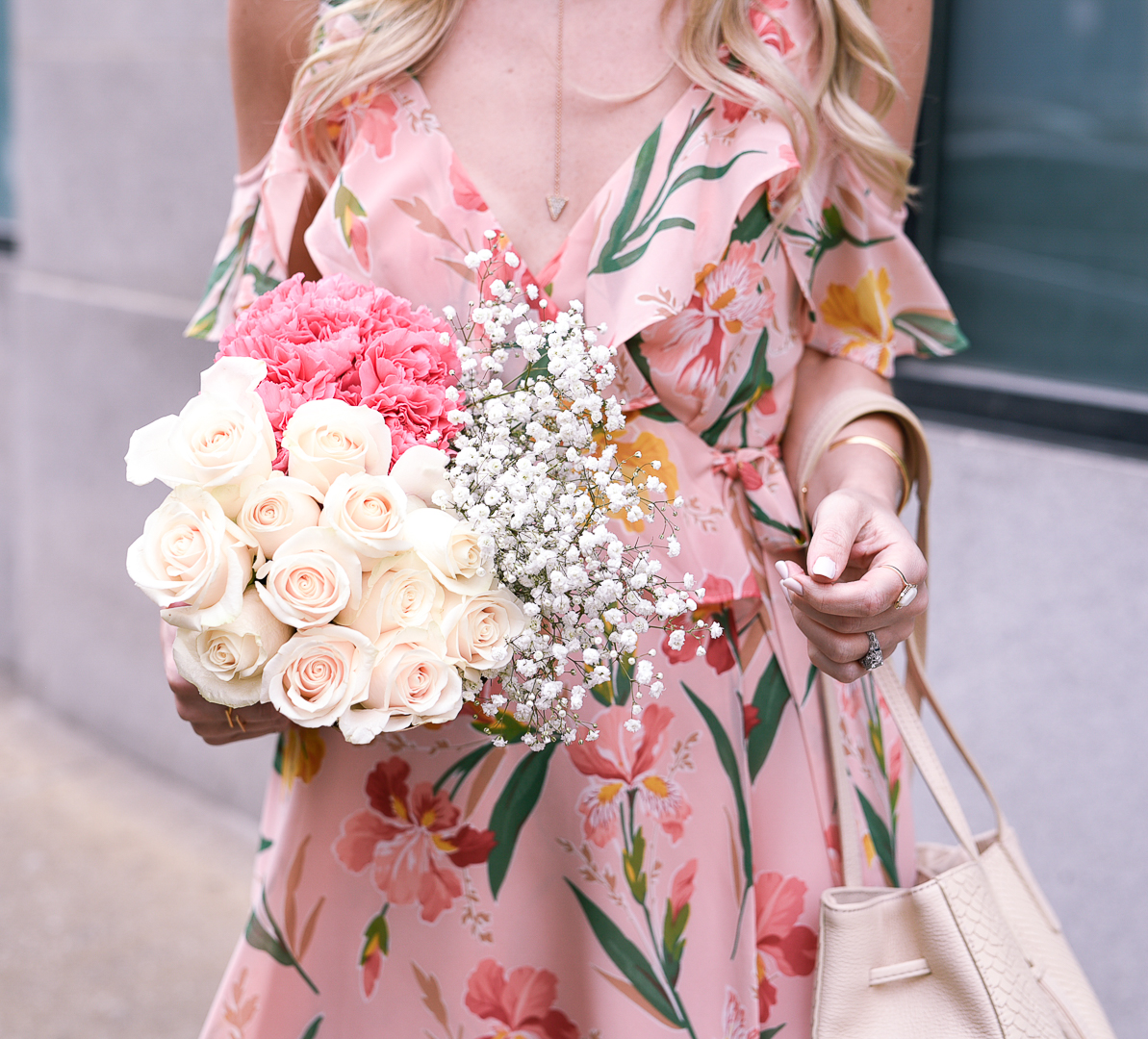 Fresh white and pink flowers with a gold Y necklace. 