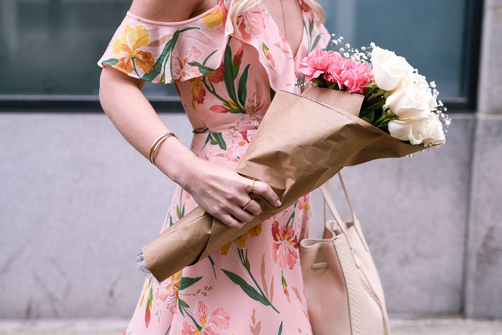 Pink carnations and white roses with gold bangle braclets. 